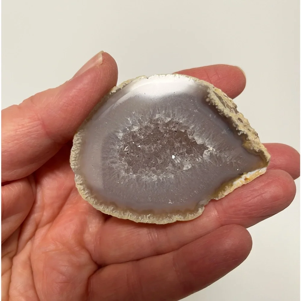 Geode with sparkly tiny crystals in center.